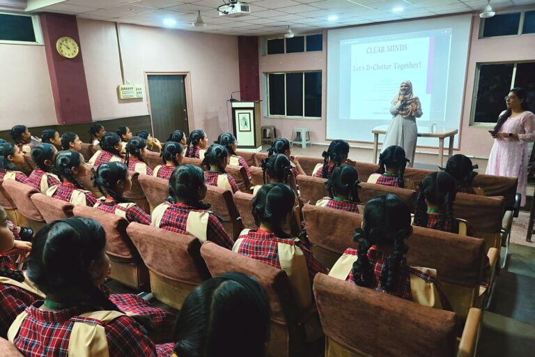 D-Clutter Young Minds mental health awareness session with students in a school auditorium