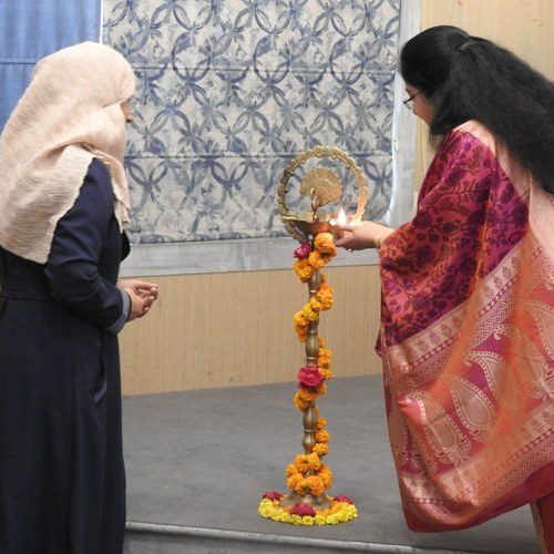 Ceremonial lamp-lighting at the opening of a Kikstart Project DIA event